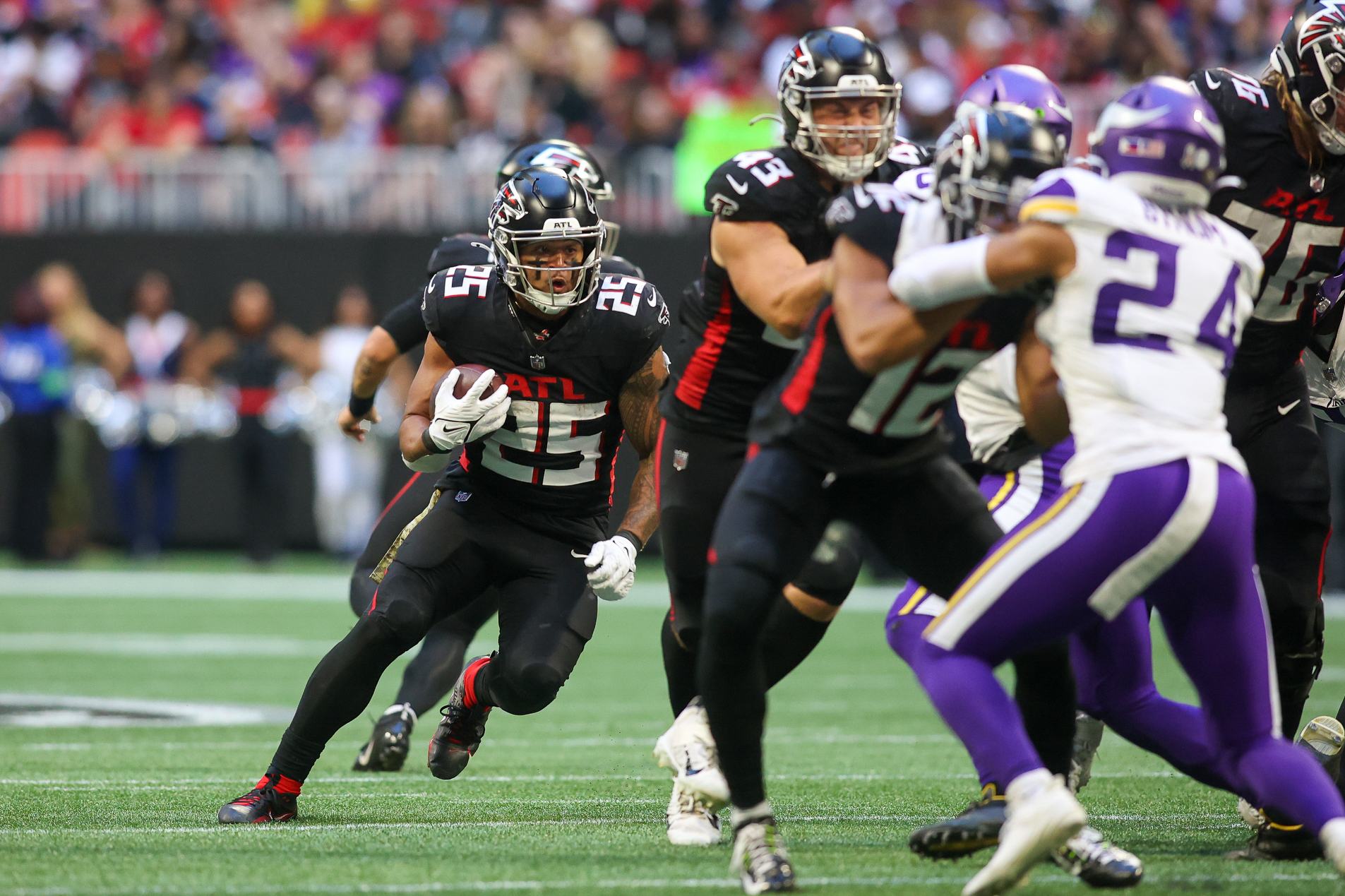 Nov 5, 2023; Atlanta, Georgia, USA; Atlanta Falcons running back Tyler Allgeier (25) runs the ball against the Minnesota Vikings in the second half at Mercedes-Benz Stadium.